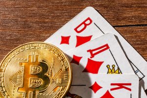 Bitcoin On Top Of Playing Cards. Online Gambling With Cryptocurr